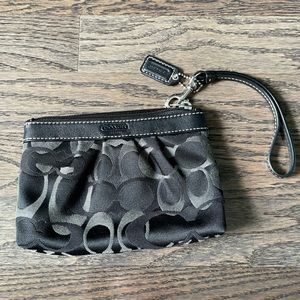 Black small Coach wristlet in excellent condition. Great for a gift!